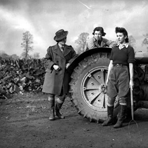 Womens Land Army girls with a tractor probably taken on farms in North Somerset