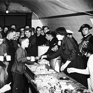 Womens Voluntary Service serve tea and sandwiches to people sheltering from German