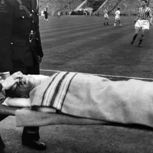 Wood, R. Play continues whilst ambulance men trying to stop the bleeding from his nose is