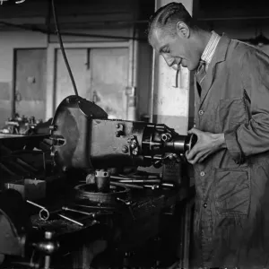 Worker assembling a gearbox in the Triumph car factory in Coventry. 23rd September 1931 Worker assembling a gearbox in the Triumph car factory in Coventry. 23rd September 1931