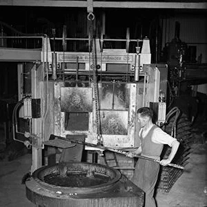 A worker at K & L Steel Founders and Engineer Limited seen here preparing a furnace for
