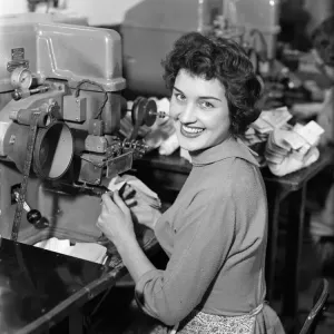 Worker at the Mansfield shoe factory in Northampton operating a labelling machine Worker at the Mansfield shoe factory in Northampton operating a labelling machine