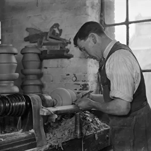 Worker operating a pottery lathe in Doultons Pottery Factory, Lambeth, London