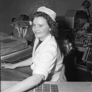 Worker on the production line at the Cadbury factory at Bourneville 26th March 1953 Worker on the production line at the Cadbury factory at Bourneville 26th March 1953