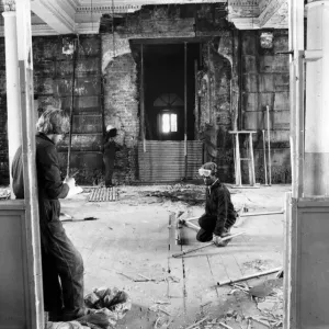 A worker is supervised inside the Queens Hotel section of the old Curzon Street Station