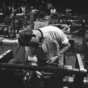 Workers casting moulds on the shop floor of the G. E. C. Foundry, Electric Avenue, Witton Workers casting moulds on the shop floor of the G. E. C. Foundry, Electric Avenue, Witton