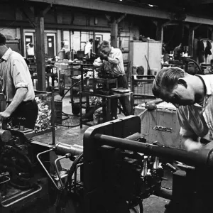 Workers casting moulds on the shop floor of the G. E. C. Foundry, Electric Avenue, Witton Workers casting moulds on the shop floor of the G. E. C. Foundry, Electric Avenue, Witton