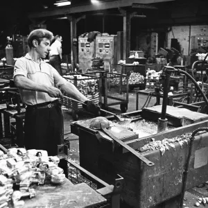 Workers casting moulds on the shop floor of the G. E. C. Foundry, Electric Avenue, Witton Workers casting moulds on the shop floor of the G. E. C. Foundry, Electric Avenue, Witton