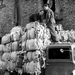Workers load a lorry with 50 bales of salvaged paper weighing three tons at Newcastle Workers load a lorry with 50 bales of salvaged paper weighing three tons at Newcastle