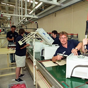 Workers on the pilot production line at the new Samsung factory Wynyard
