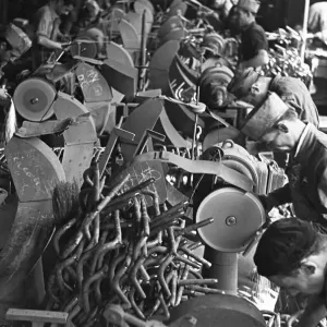 Workers on the production line at the Bianchi motorcycle factory in Milan producing Workers on the production line at the Bianchi motorcycle factory in Milan producing