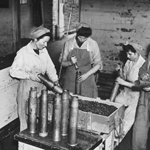 Workers at the Royal Ordinance factory at Chorley in Lancashire destroy shells at the end