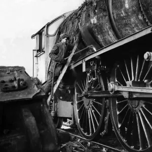 A Workman Cutting Up an Old Engine Print, 5th January 1965 A Workman Cutting Up an Old Engine Print, 5th January 1965