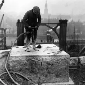 A workman drilling holes in one of the bedstones on the Gateshead abutment for A workman drilling holes in one of the bedstones on the Gateshead abutment for