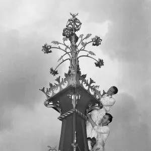 A workmen cleaning the finial of the Queen Elizabeth Tower part of the major overhaul of A workmen cleaning the finial of the Queen Elizabeth Tower part of the major overhaul of