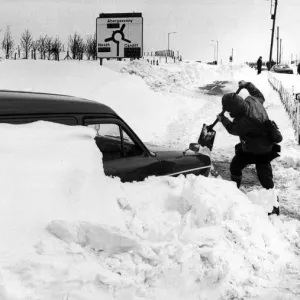 Workmen dig out a van, Dowlais High Street 1981 Print Workmen dig out a van, Dowlais High Street 1981 Print