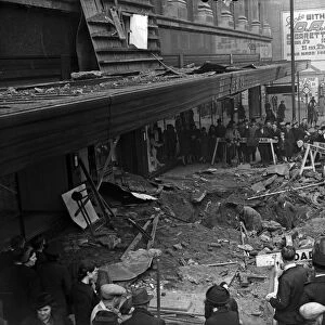 Workmen filling a crater outside Greys department store, Bull Street