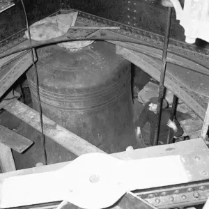 A workmen inspects the bell Big Ben during the major overhaul of all the bells A workmen inspects the bell Big Ben during the major overhaul of all the bells
