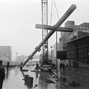 Workmen moving Britains tallest free-standing cross into position at Carrs Lane