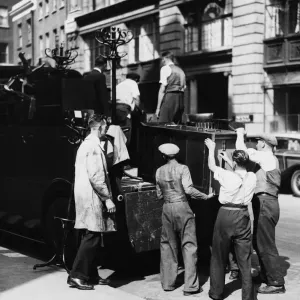 Workmen requisition furniture, Tufnell Park Holloway. 31st August 1939 Workmen requisition furniture, Tufnell Park Holloway. 31st August 1939