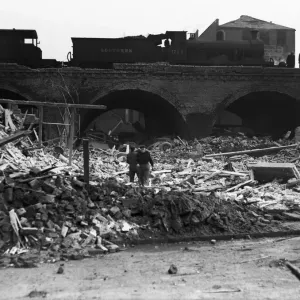 Workmen search through the rubble following a V2 attack on Camberwell Workmen search through the rubble following a V2 attack on Camberwell