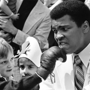 World heavyweight boxing champion Muhammad Ali presented a sunshine coach on the behalf