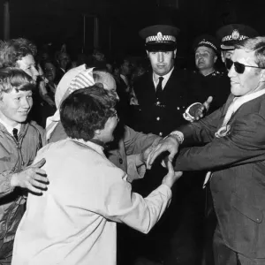 Print of Ken Buchanan surrounded by fans after USA victory