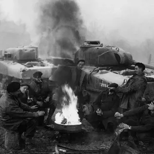 World War 2 Belgium December 1944 Troops from a tank recovery unit relax around a World War 2 Belgium December 1944 Troops from a tank recovery unit relax around a