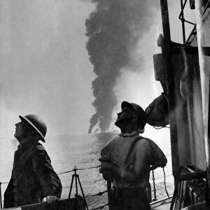 World War II: Shipping. HMS fearless seen here in the background on fire after being hit