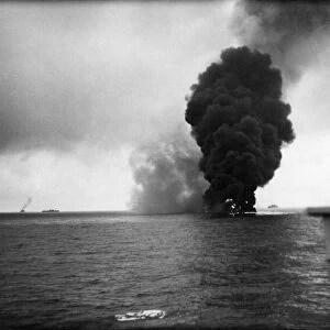 World War II: Shipping A Oil tanker a blaze after being torpedoed by a German U-boat in