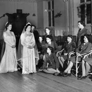 World War II Women: Two A. T. S. girls trying out wedding dresses at a A. T. S. hostel World War II Women: Two A. T. S. girls trying out wedding dresses at a A. T. S. hostel