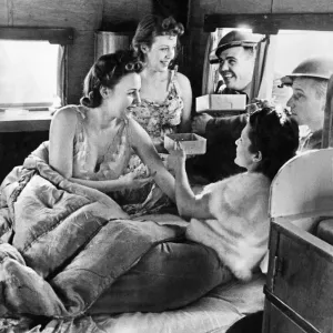 World War II Women. Three ATS girls who live in a Caravan seen here getting the attention