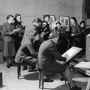 World war II Women: Members of the WaF take a break from their training to draw in a