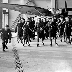 World War II Women. WaF and RAF ground crew seen here roller skating at their station a