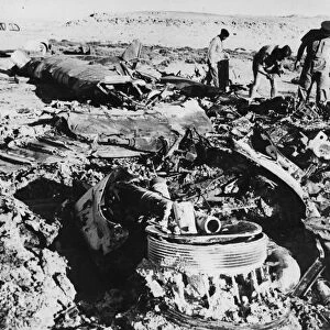 The Wreckage of a Heinkel III, lies burned out and twisted at the edge of a salt lake