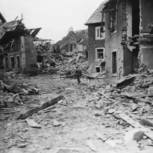 Wreckage wrought by American aircraft and artillery is noted by a US Third Army