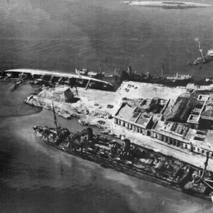 Wrecked and capsized enemy merchant vessels line the quays in the harbour at Naples
