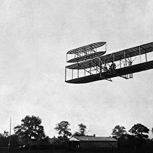 The Wright Brothers plane being flown in Pau, France, 1909