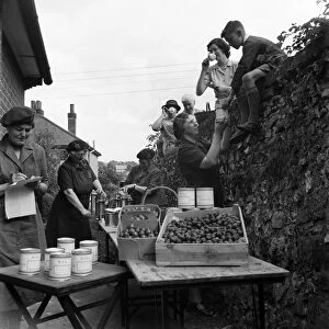 WVS canning centre at Lyminge, Folkestone, Kent. Women turning out 250 cans of fruit a