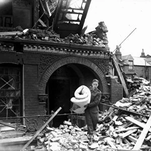 WW2 Air Raid Damage Tooting Bomb damage at Tooting London A soldier carries