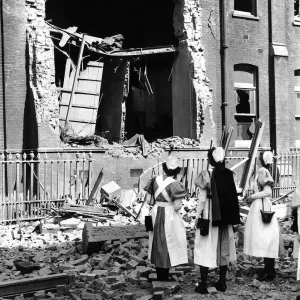 WW2 Bomb damaged Hospital Sept 40 Nurses looking at damage WW2 Bomb damaged Hospital Sept 40 Nurses looking at damage
