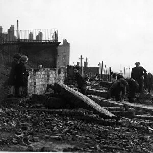 WW2 II Scotland Glasgow Clydebank Air Raid Two children watch workmen clear away