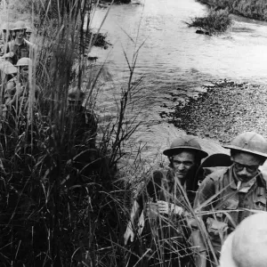 WW2 patrol advancing through the rushes on their way to Mohnyin