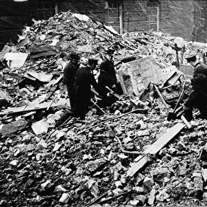 WW2 Rescue workers search rubble Dec 1940 of a building in City Road London