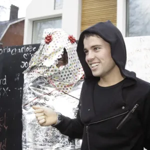 X factor contestant Joe McElderry greets a fan outside the finalists house X factor contestant Joe McElderry greets a fan outside the finalists house