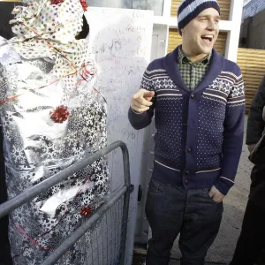 X factor contestant Olly Murs greets a fan outside the finalists house X factor contestant Olly Murs greets a fan outside the finalists house