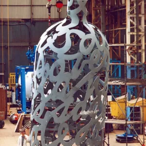 Yard electrician Peter Gilpin is dwarfed by the huge 35 foot metal bottle ordered by Yard electrician Peter Gilpin is dwarfed by the huge 35 foot metal bottle ordered by