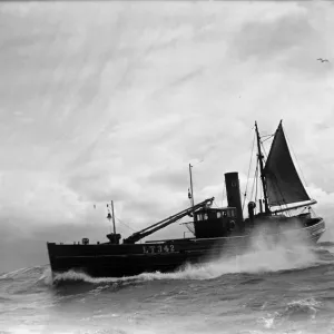 A Yarmouth Herring boat ploughing through a moderate swell in the North Sea. Circa 1935 A Yarmouth Herring boat ploughing through a moderate swell in the North Sea. Circa 1935