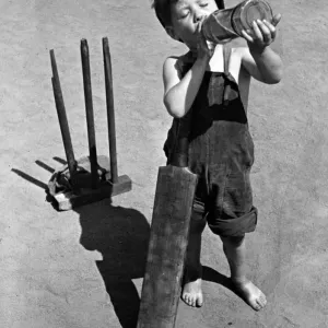 1948 Print: Boy Plays Cricket on a Hot Day in Shadwell 1948 Print: Boy Plays Cricket on a Hot Day in Shadwell