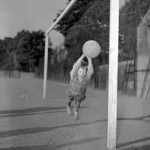 Ten year old George Welch makes a flying save while in goal for his school football team Ten year old George Welch makes a flying save while in goal for his school football team